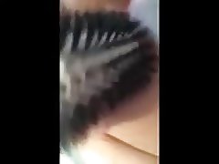 Horny slut working her pussy with a hairbrush handle
